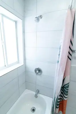 a bathroom with a shower with a sink at N. Miami Studio | Stylish Stay Minutes from Ocean in North Miami
