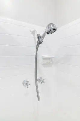 a shower with a shower head in a bathroom at Modern Studio Apt • Prime North Miami Location in North Miami