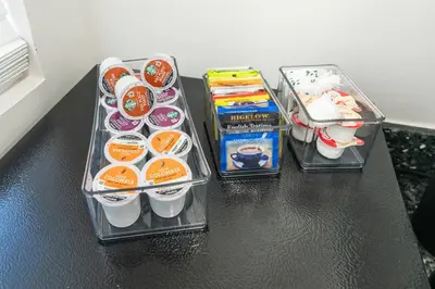 a black table with three containers of food on it at Spacious 1BR in North Miami | Near Beach & Dining in North Miami