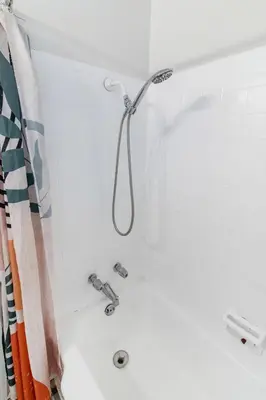 a shower in a bathroom with a shower head at Spacious 1BR in North Miami | Near Beach & Dining in North Miami