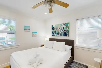 a bedroom with a bed with two teddy bears on it at Palm & Pool Retreat in Fort Lauderdale