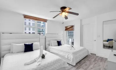 a bedroom with two beds and a ceiling fan at Skyline with Water views 2 bedroom in Miami