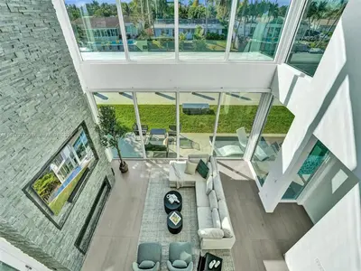 an overhead view of a living room with a couch and chairs at Modern waterfront property in Fort Lauderdale