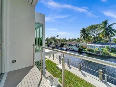 a balcony with a view of the water at Modern waterfront property in Fort Lauderdale