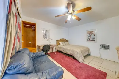 a living room with a couch and a bed at 8 Mi to Beach! Miramar Guest Suite with Pool Access in Miramar