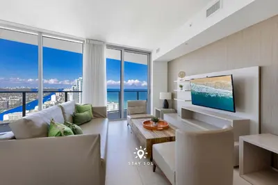 a living room with a view of the ocean at Beautiful 1BR Apartment with Ocean View Balcony in Hollywood