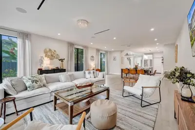 a living room with a white couch and a table at New 4BR Upscale Family Haven in Fort Lauderdale