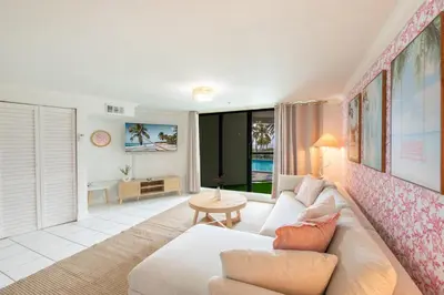 a living room with a couch and a table at Casablanca Residences Miami Beach in Miami Beach