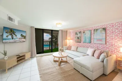 a living room with a couch and a table at Casablanca Residences Miami Beach in Miami Beach