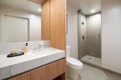 a bathroom with a sink and a toilet and a shower at The Crosby Miami World Center in Miami