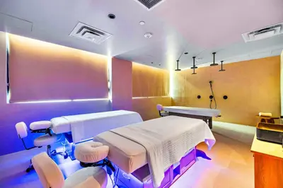 a hospital room with two beds and chairs at Downtown Luxury Stay with Complimentary Parking in Miami