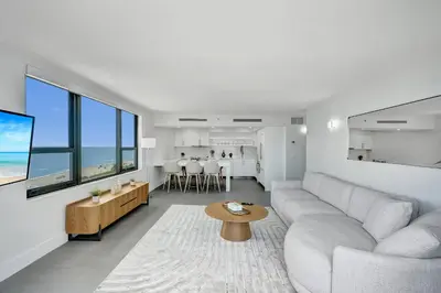 a living room with a couch and a table at Oceanfront Luxury 3BR 3BA Condo with Resort Pools Gym and Sauna 902 in Miami Beach