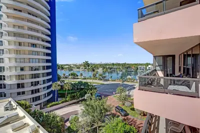 a view of the water between two buildings at Modern 4BR with Ocean Views Pools and Direct Beach Access in Miami Beach