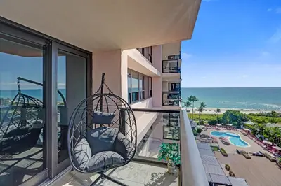 a balcony with swings and a view of the ocean at Miami Beach Paradise 4BR Stylish condo with Resort Perks 1007 in Miami Beach