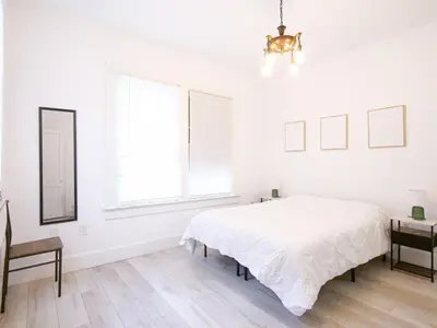a white bedroom with a large bed and a window at Cozy 2Bed 1Bath in Edgewater Miami in Miami