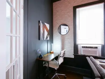 a room with a desk with a chair and a window at Cozy 2Bed 1Bath in Edgewater Miami in Miami