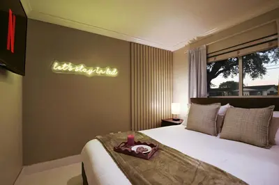 a bedroom with a bed with a sign on the wall at Olympia LUX House 4BR, Heated POOL, BBQ, BAR in Miami