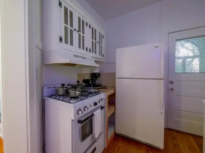 a kitchen with a white stove and a refrigerator at Central & Stylish Miami Getaway in Miami