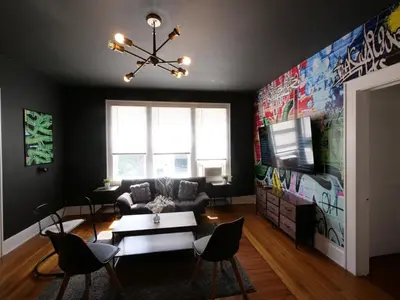 a living room with a couch and a tv at Central & Stylish Miami Getaway in Miami