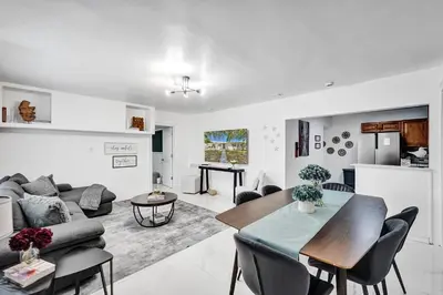 a living room with a couch and a table at Charming 3 bedroom getaway house in Hollywood in Hollywood