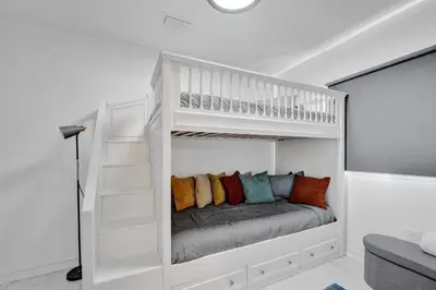 a white bunk bed in a white room at Charming 3 bedroom getaway house in Hollywood in Hollywood