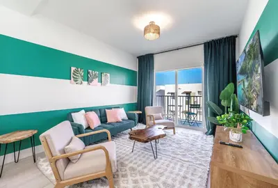 a living room with a couch and chairs in a room at Event-Ready 2BR 2BA Near Stadium & Beach includes Parking and Washer and Dryer in Hallandale Beach