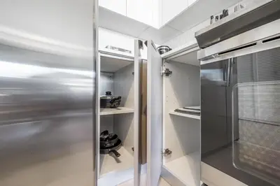 a kitchen with a stainless steel refrigerator at Event-Ready 2BR 2BA Near Stadium & Beach includes Parking and Washer and Dryer in Hallandale Beach