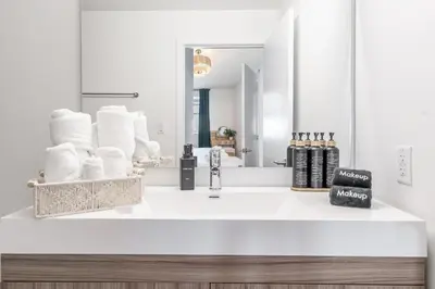 a bathroom counter with a sink and a mirror at Event-Ready 2BR 2BA Near Stadium & Beach includes Parking and Washer and Dryer in Hallandale Beach