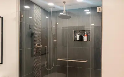 a shower with a glass door in a bathroom at Garden of Manors - Men Only Clothing Optional Boutique Guesthouse in Florida in Fort Lauderdale