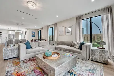 a living room with a couch and a table at Upscale 4 BDRM Retreat - Mins to Las Olas & Beach in Fort Lauderdale