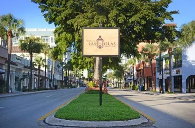 a sign in the middle of a street at Upscale 4 BDRM Retreat - Mins to Las Olas & Beach in Fort Lauderdale