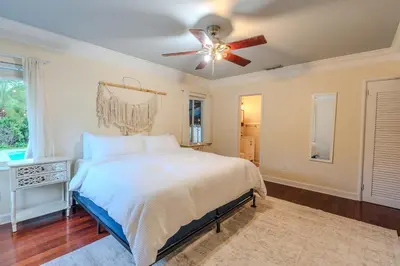 a bedroom with a bed and a ceiling fan at Villa Calma Hidden Tropical Gem with Gym and Pool in Hollywood