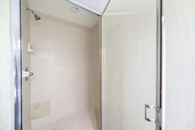 a shower with a glass door in a bathroom at Ocean Breeze Retreat in Miami Beach in Miami Beach