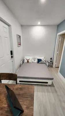 a bedroom with a large bed in a room at Blue Loft305 in Hialeah