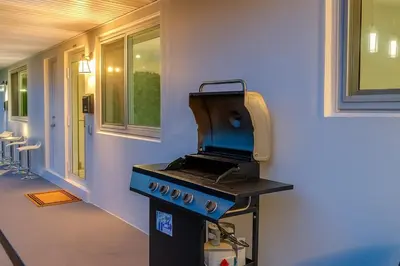 a bbq grill in the corner of a house at Steps from Airport Hot Tub Bbq Boat Slip in Dania Beach