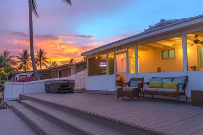 a house with a deck with a couch and a grill at Waterfront HotTub Steps from the Airport Boat Slip in Dania Beach