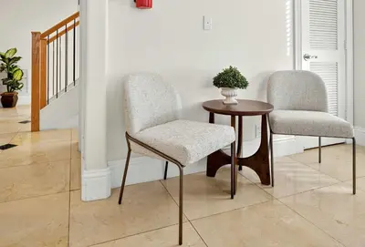 two chairs and a table in a room at Hollywood Crest by Rove Travel - Home with Heated Pool in Hollywood
