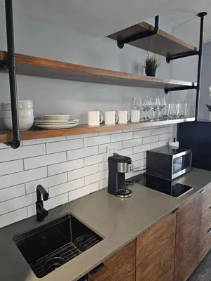 a kitchen with a counter top with a coffee maker at Sunny Isles Oceanfront Apartment for Two in Sunny Isles Beach