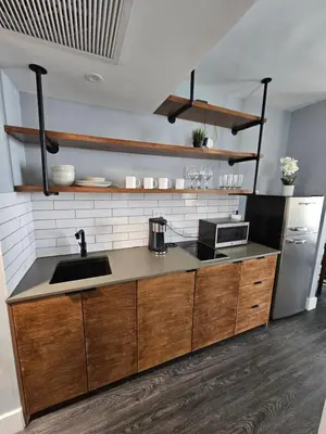 a kitchen with a sink and a counter top at Sunny Isles Oceanfront Apartment for Two in Sunny Isles Beach