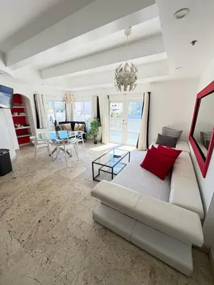 a living room with a couch and a table at Incredible South Beach Penthouses with private terrace in Miami Beach