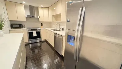 a kitchen with a stainless steel refrigerator at Beachfront 2BR at The Tides | EPIC Stay in Hollywood