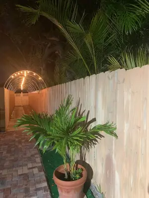 a plant in a pot next to a wooden fence at Zen Garden Studio in Hollywood