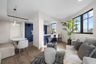 a living room with a couch and a table at The Avenue Hotel Coral Gables in Miami