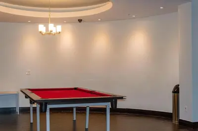a ping pong table in the middle of a room at The Azul Beachview Get away in Hollywood