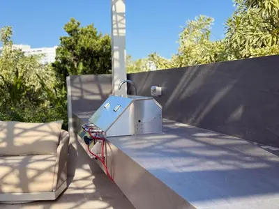 a metal appliance sitting on the side of a fence at Luxury View-Walk to beach! in Miami Beach