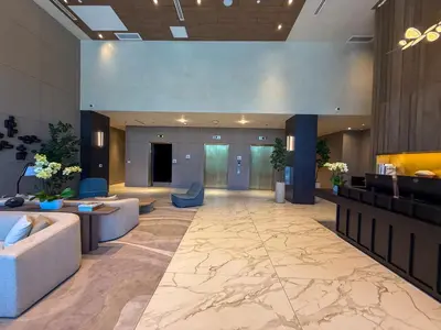 a lobby with couches and chairs in a building at Luxury View-Walk to beach! in Miami Beach