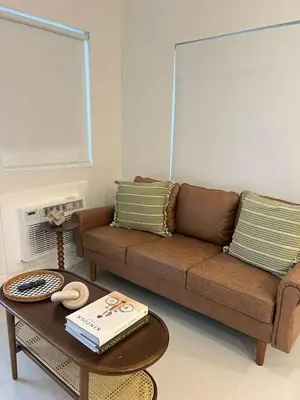 a living room with a couch and a coffee table at The Modern Oasis Queen Studio with Kitchen in Fort Lauderdale
