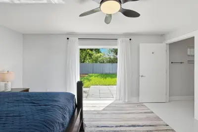 a bedroom with a bed and a ceiling fan at 2BR Home Near Wilton Manors & Downtown in Fort Lauderdale