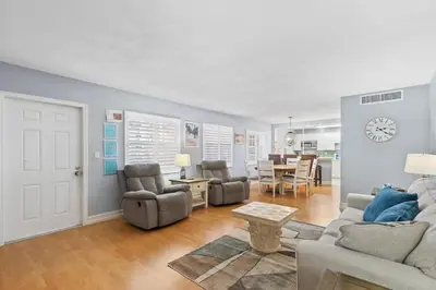 a living room with a couch and chairs and a table at Beachside Las Olas Getaway Oasis with Pool in Fort Lauderdale