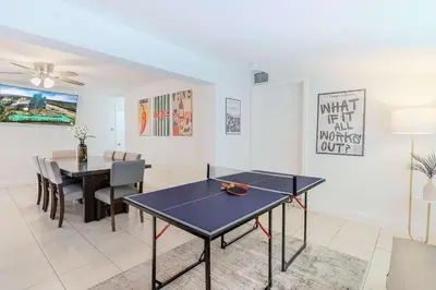 a dining room with a ping pong table in it at Villa Hollywood Pool Trampoline BBQ Hard Rock in Hollywood
